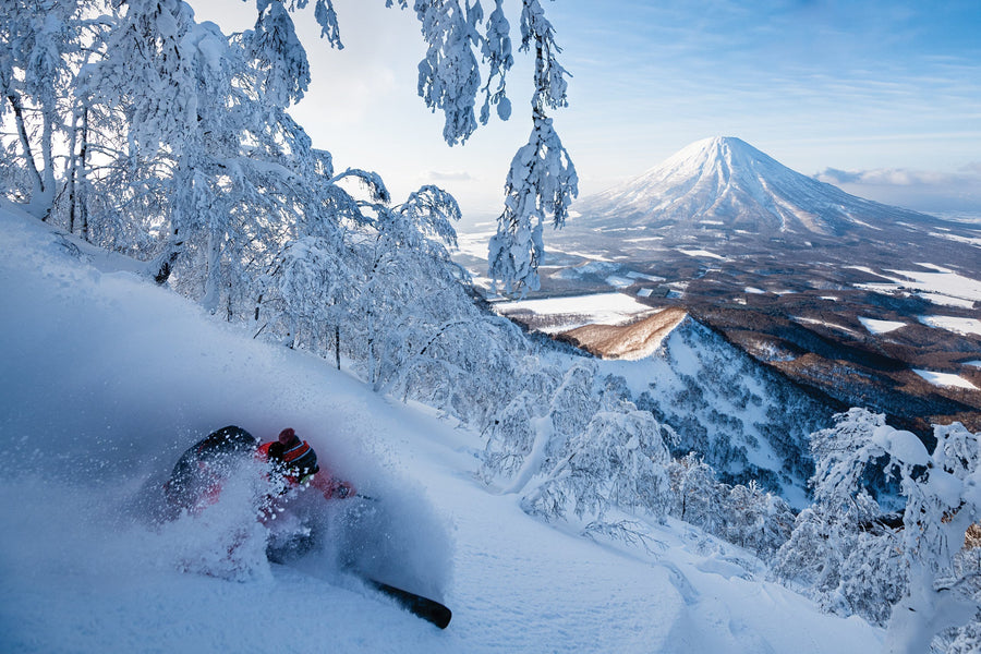 On a rare sunny day in Hokkaido, David Kantermo skis off the summit of Shiribetsu, a peak between Rusutsu and Niseko, overlooking the iconic Mount Yotei. Photo: Mattias Fredriksson