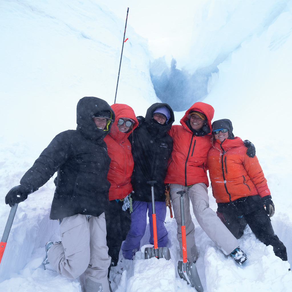 Women of Winter. Group of people in winter clothing posing in a snowy landscape
